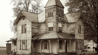 Photo of Abandoned Towered Victorian House.