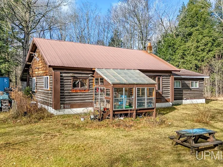 Photo of Charming Log Cabin on Nearly 10 Acres – $149,900